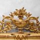 Louis-Philippe mirror from the 19th century with vase and crown of flowers.