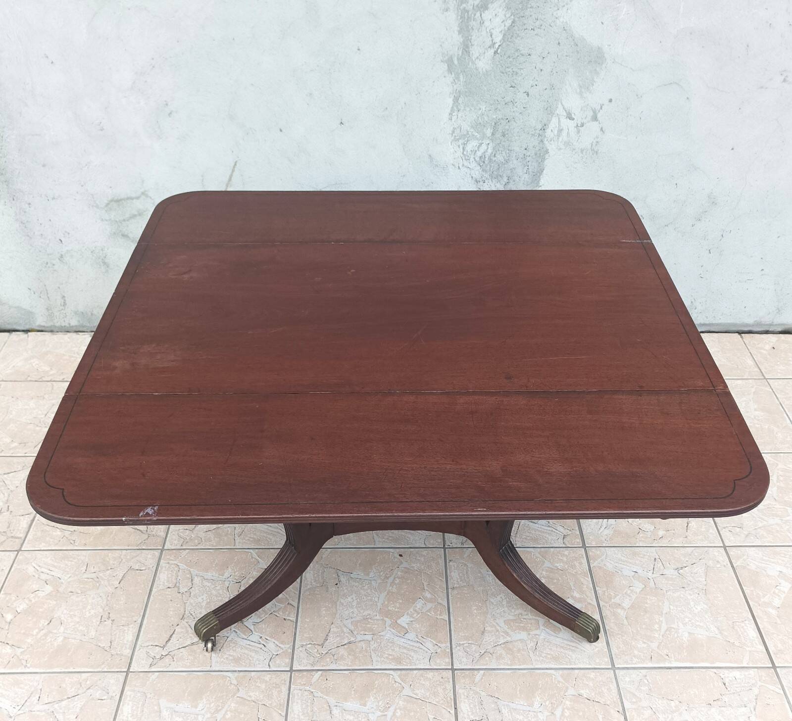 19th-century English style mahogany drop-leaf table.
