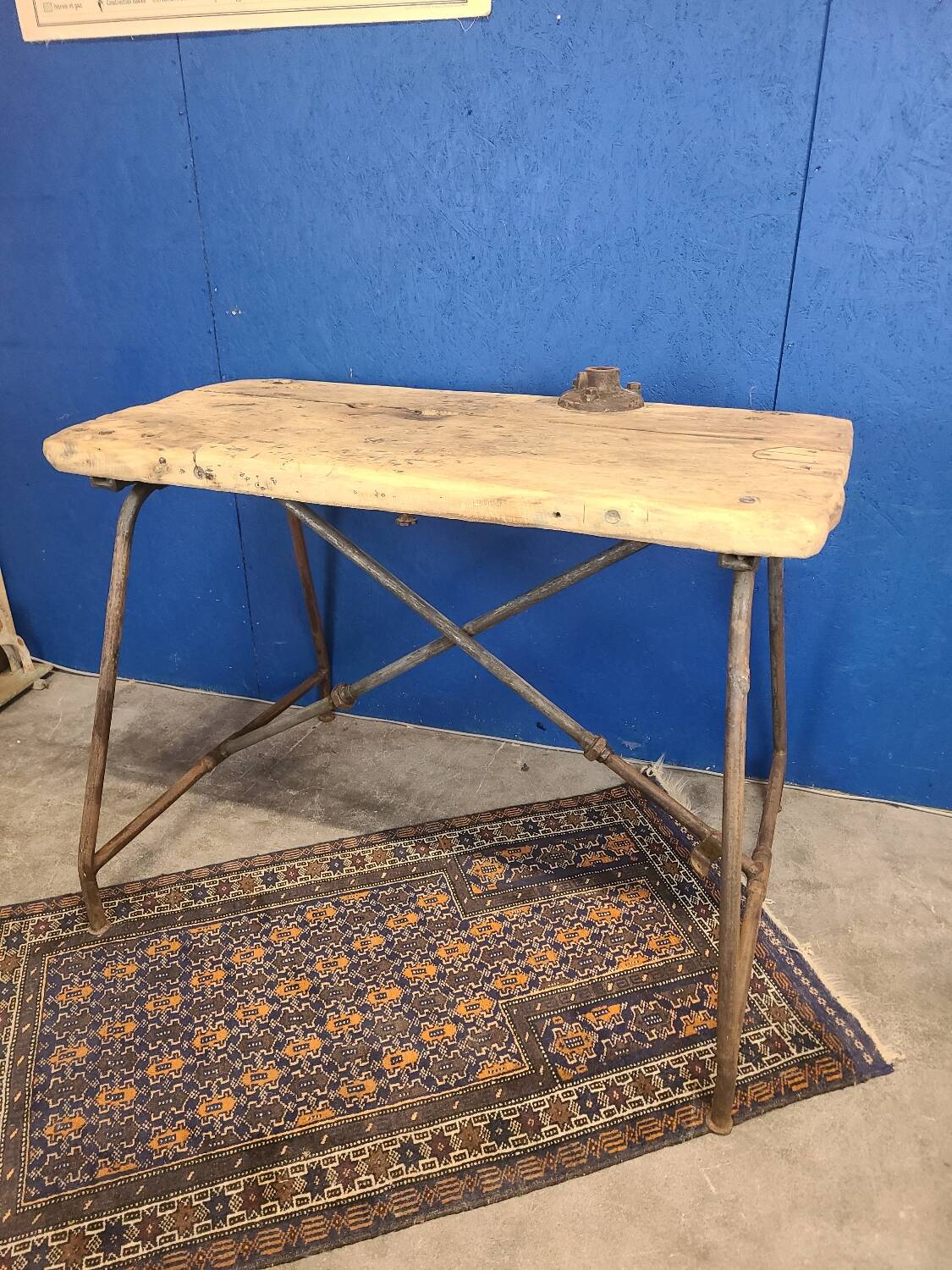 Vintage workbench circa 1930, folding metal leg.