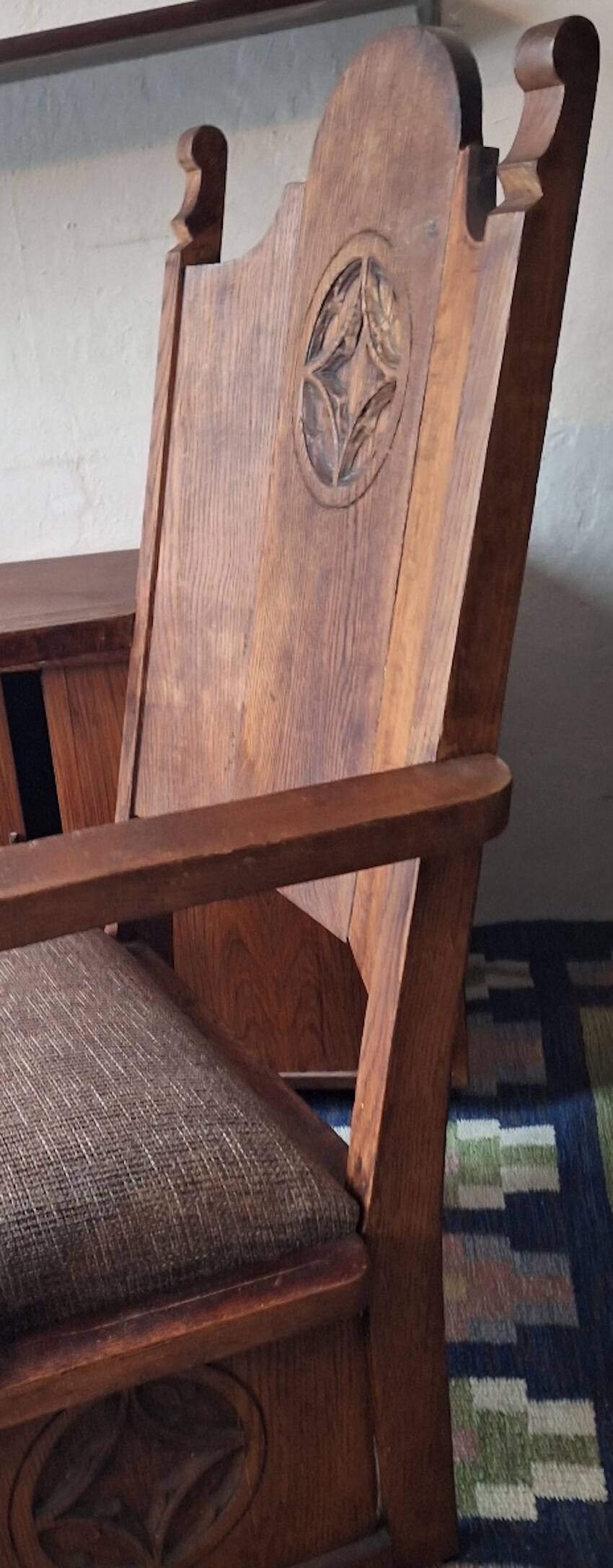 Antique Gothic Revival carved oak armchair, 1910