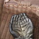 Empty pocket pair hand lucky charm brass