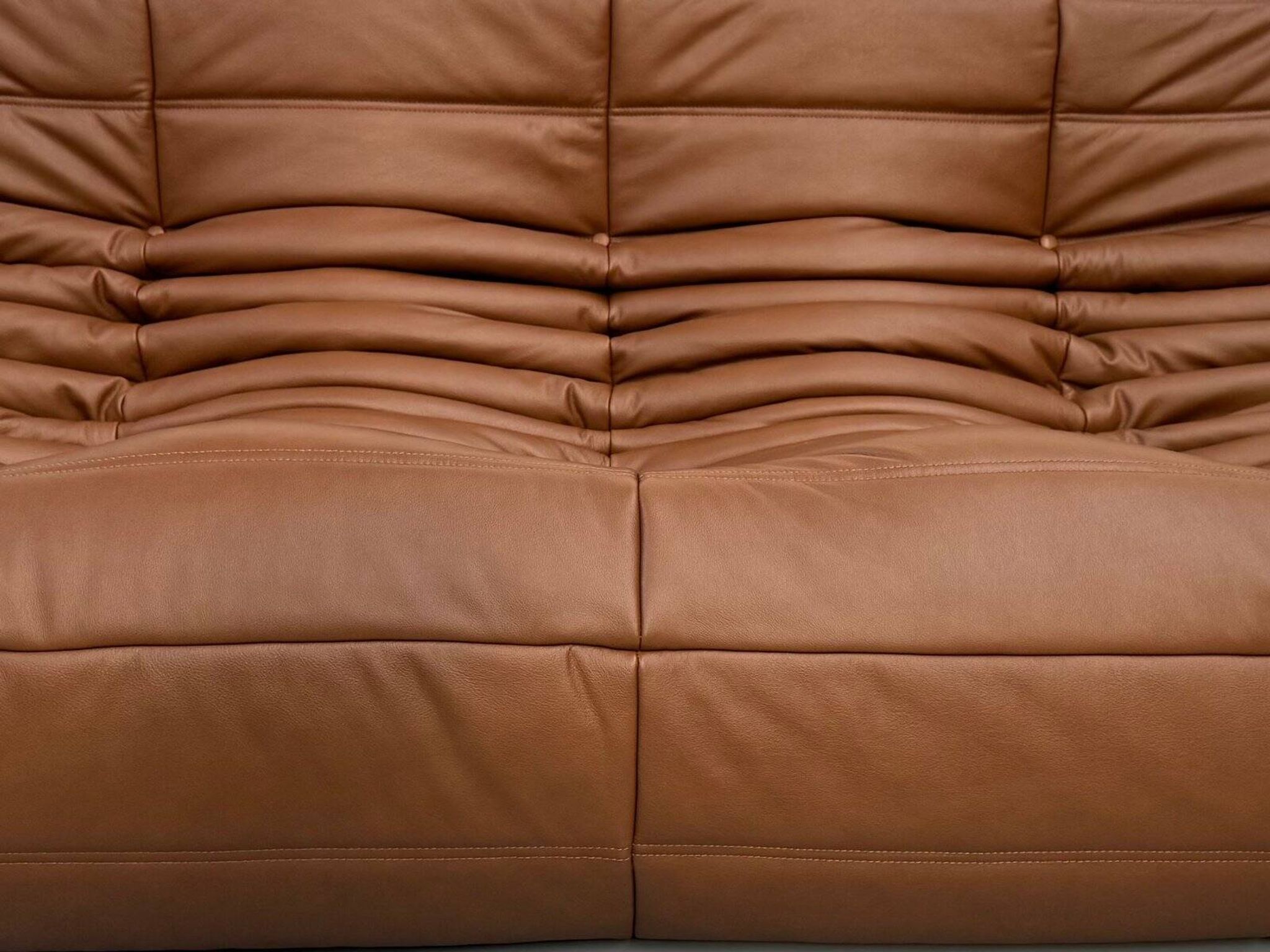 Three-seater Togo sofa in dark cognac leather by Michel Ducaroy for Ligne Roset.
