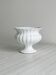 White ribbed porcelain plant pot cover