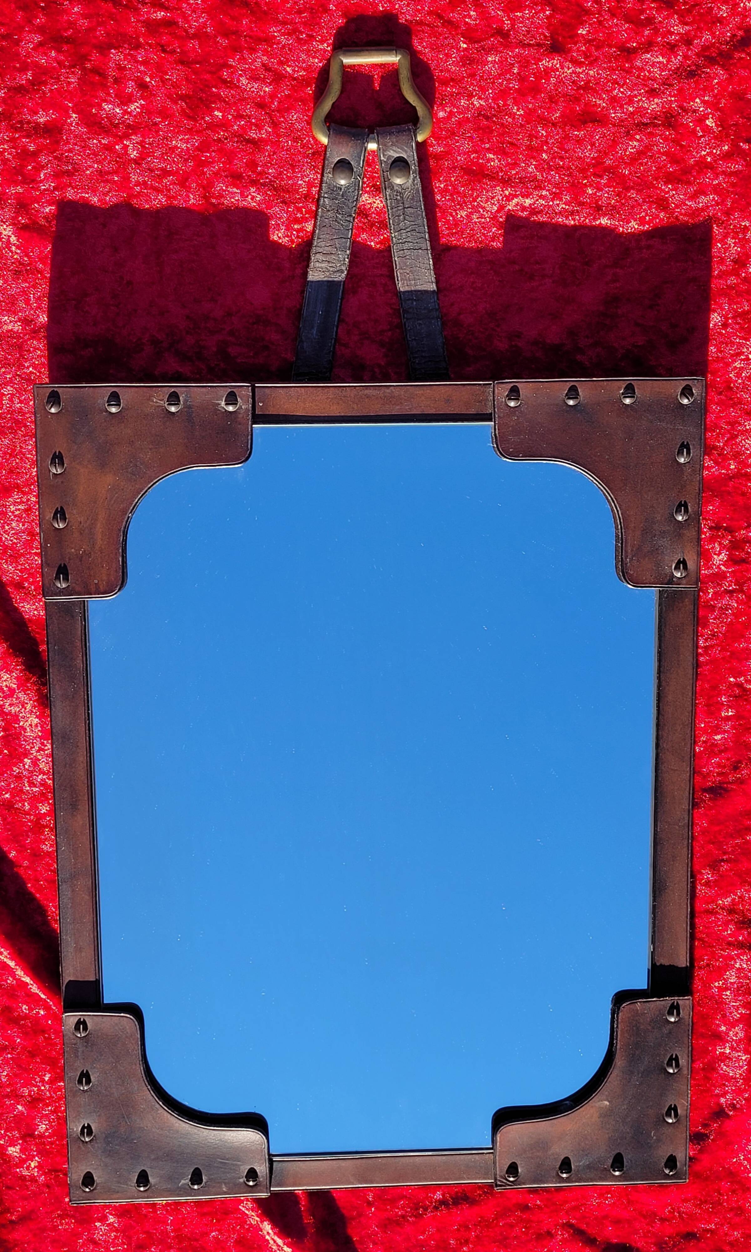 Leather-covered wall mirror attributed to Jacques Adnet 1950