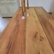 Old farmhouse table made of solid walnut wood.