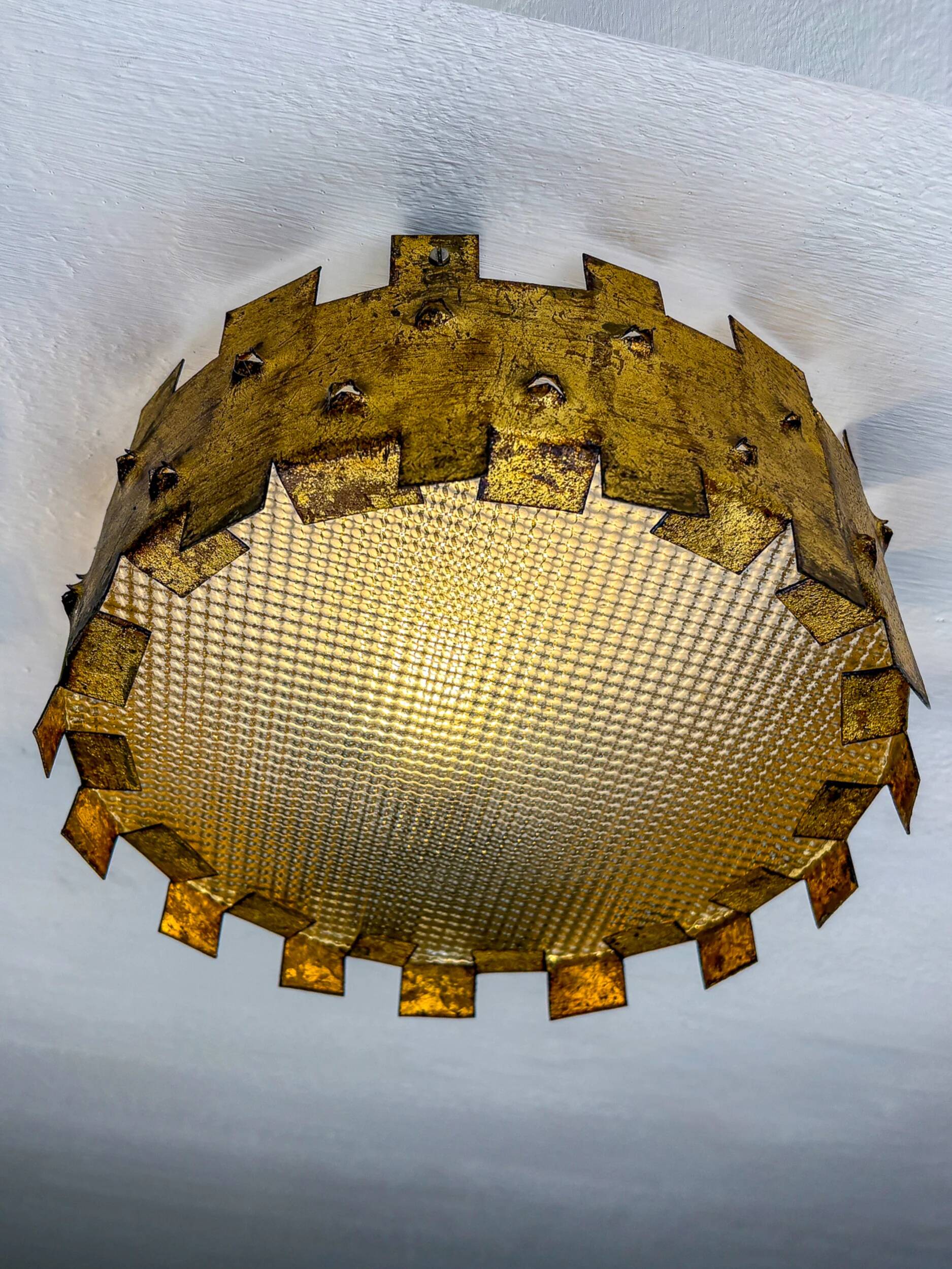 Brutalist crown sunburst fixture in gilt metal and frosted glass, France, 1960s