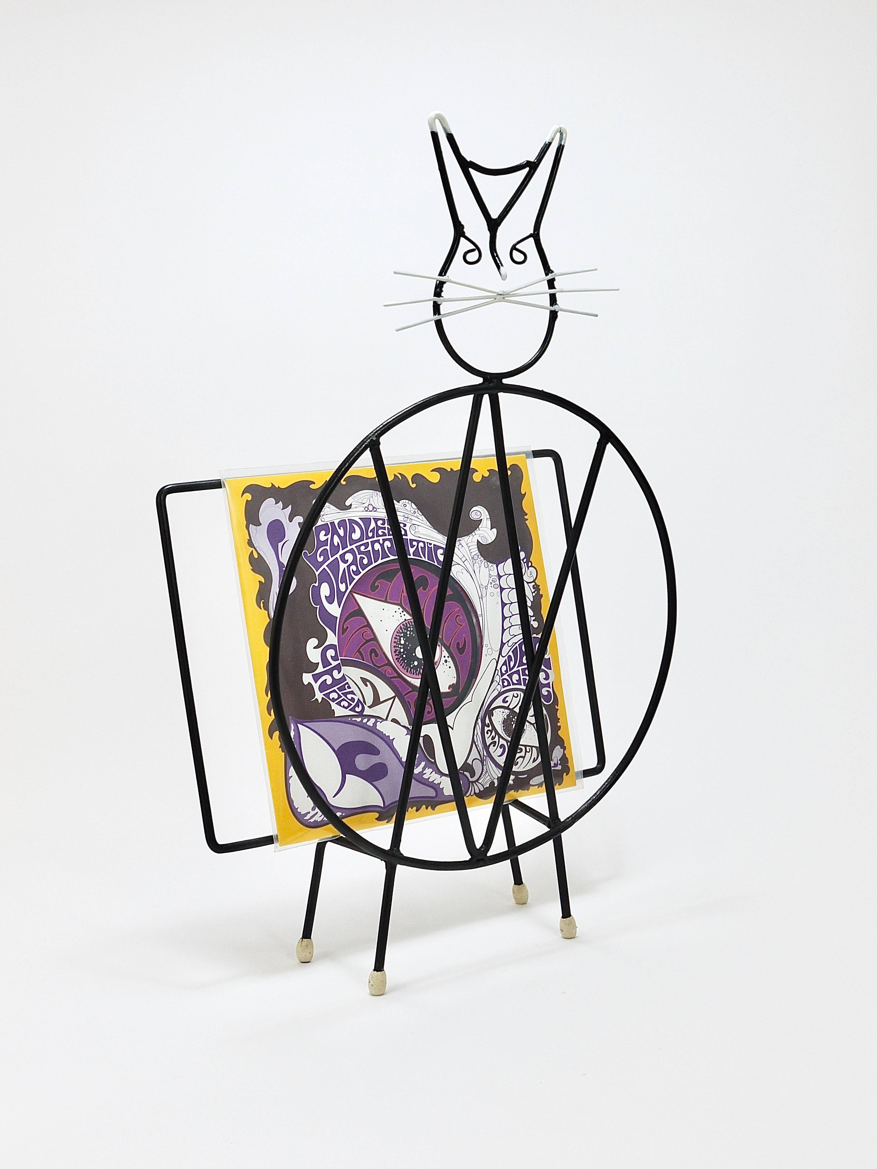 Mid-century cat-shaped magazine or record holder, iron, Italy, 1950s.