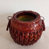 Japanese vase made of woven bamboo. Ikebana.