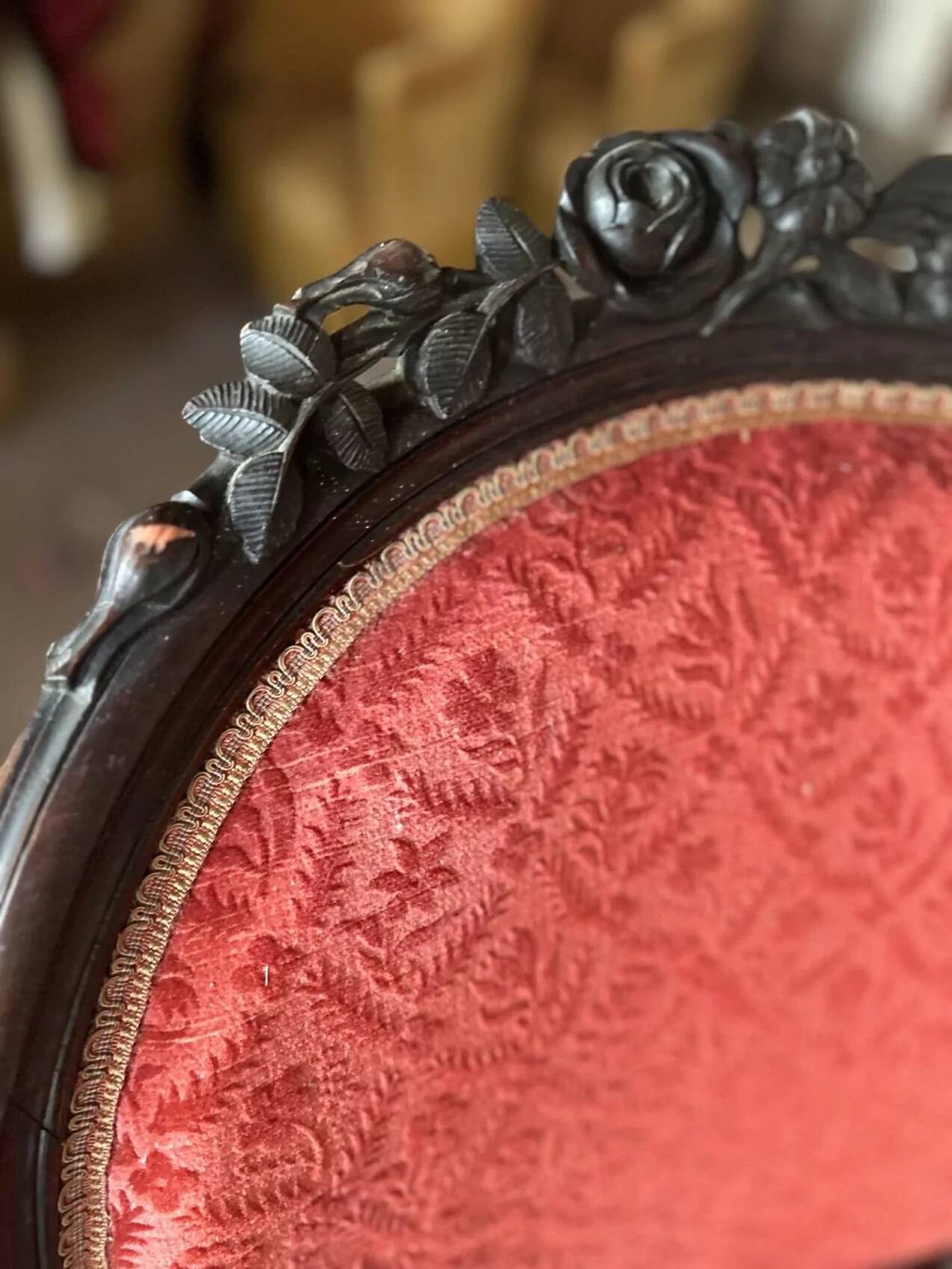 Napoleon III medallion armchair in carved wood and red velvet.