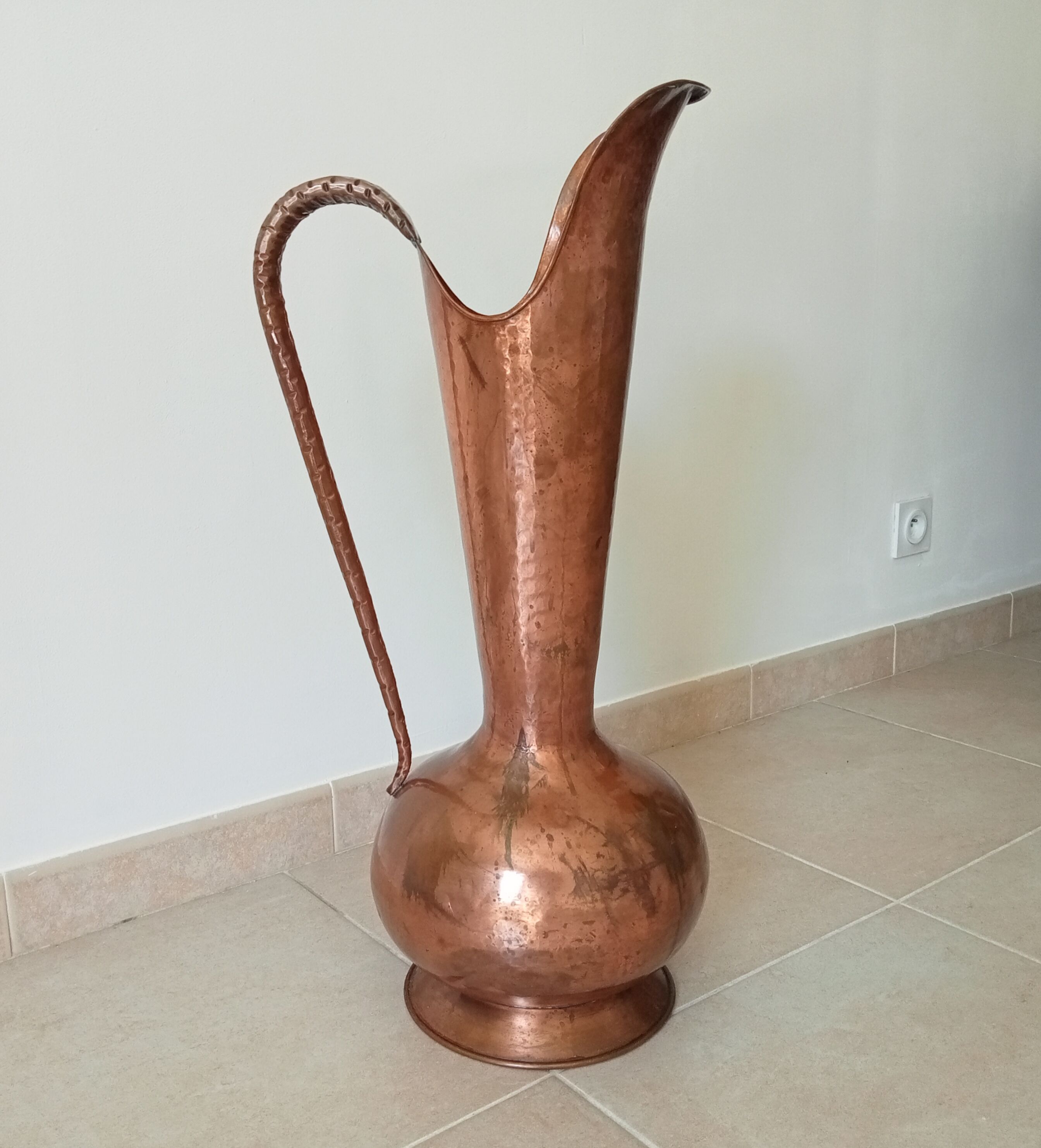 Old italian amphora vase in hammered copper