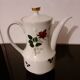 White porcelain coffee service of 3 pieces with a rose design.