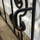 Wall-mounted coat rack in wrought iron, early 20th century