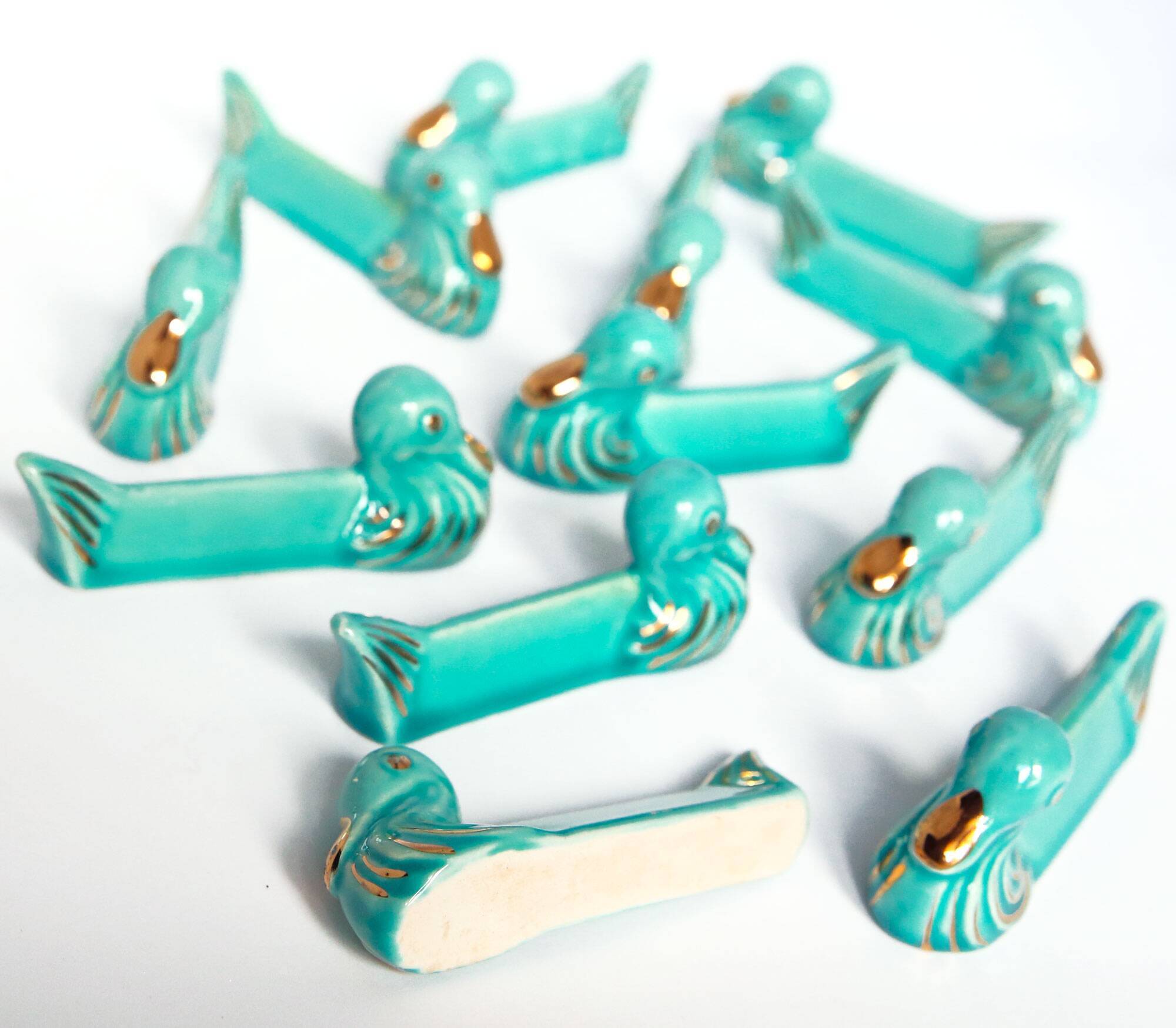 Set of 12 turquoise blue and gold duck knife holders mid-20th century