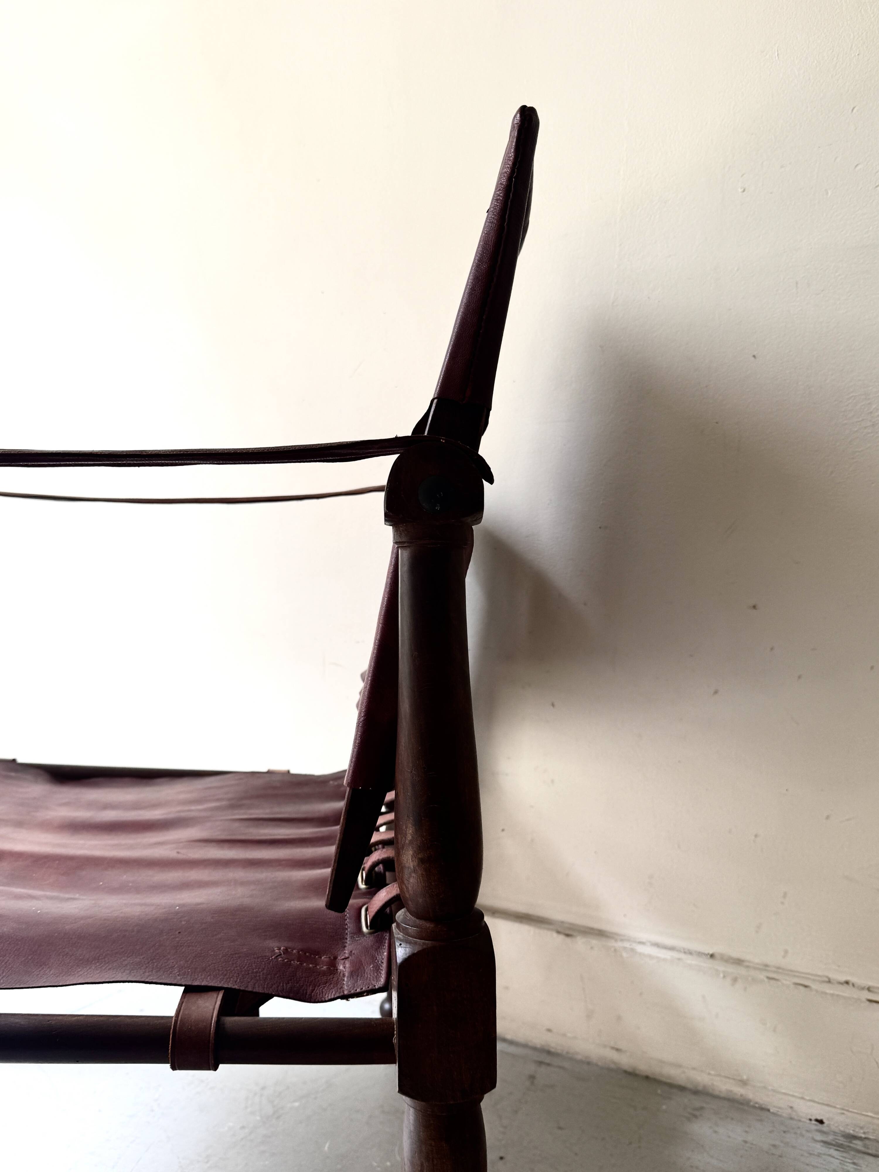 Scandinavian safari armchair in wood & burgundy leather upholstery 20th century