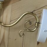 Pair of brass swan neck wall lights with white opaline glass tulip