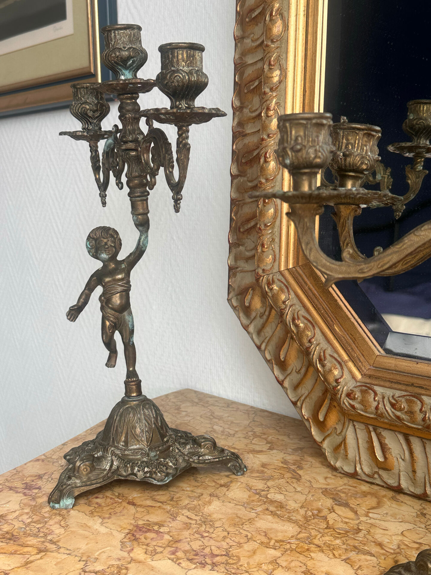 Set of 3 antique three-branch candelabras with cherubs and bronze patina.
