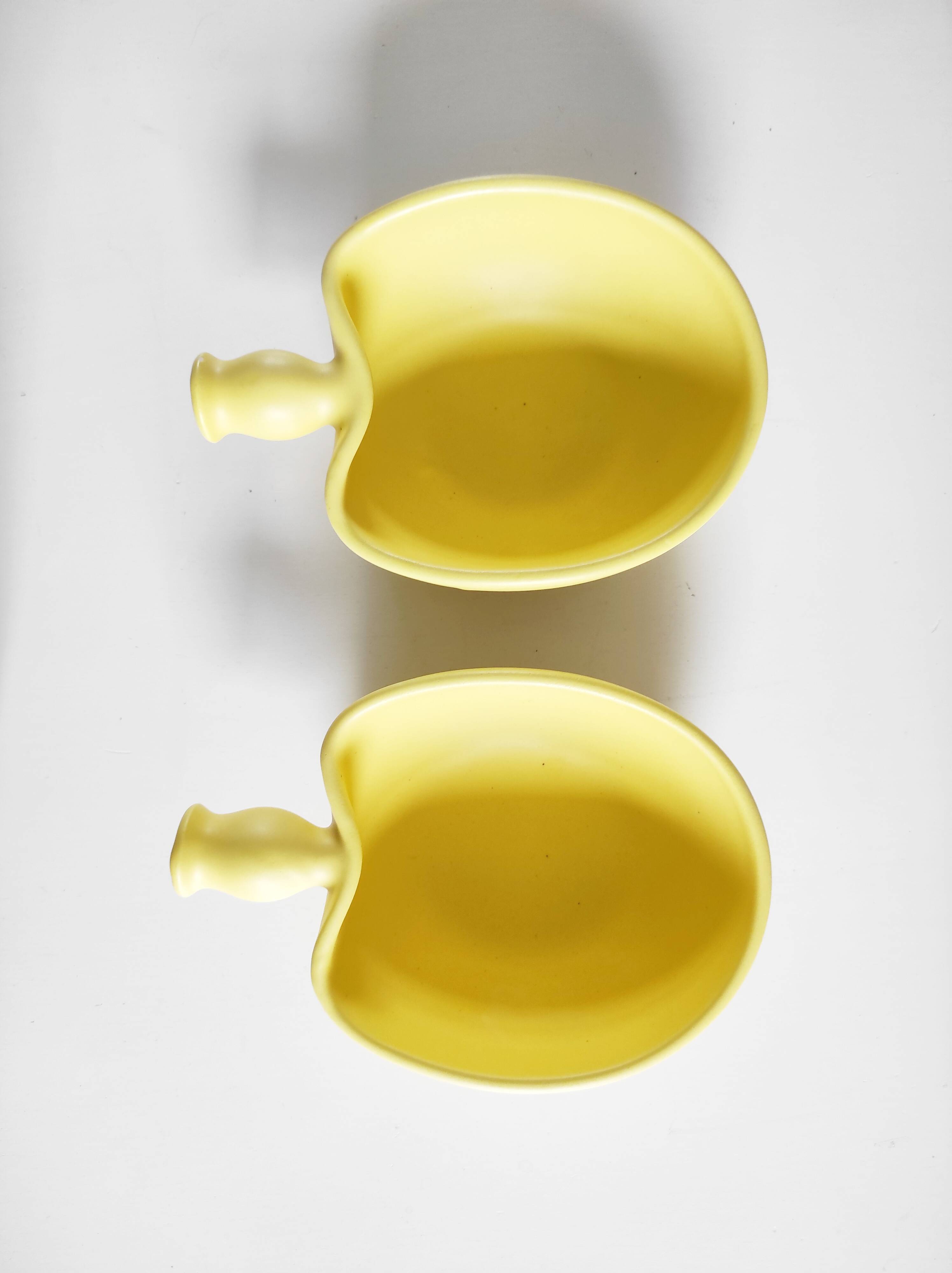 Two yellow ceramic dishes
