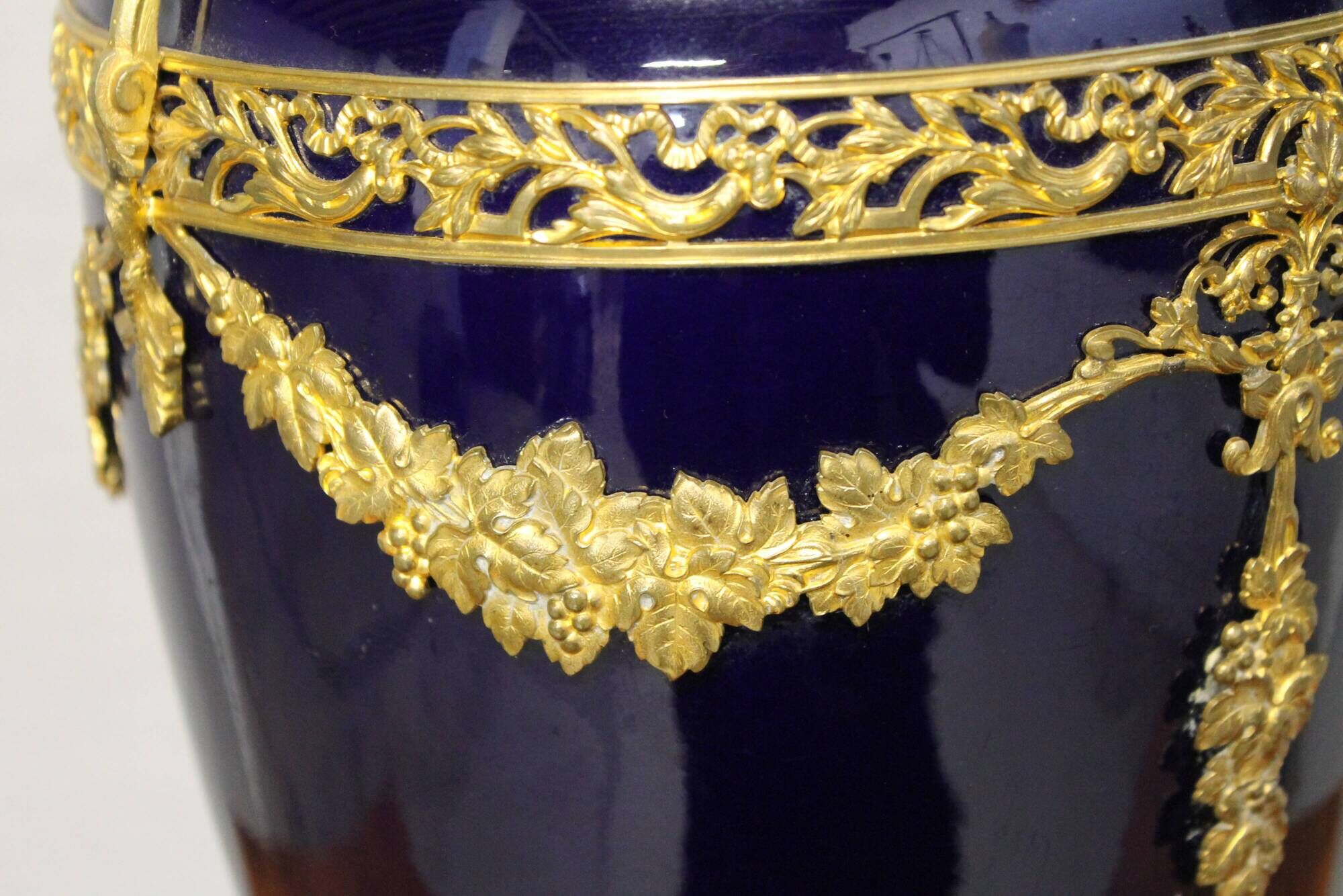 Vase signed Legastelois in blue ceramic of Sèvres and gilded bronze