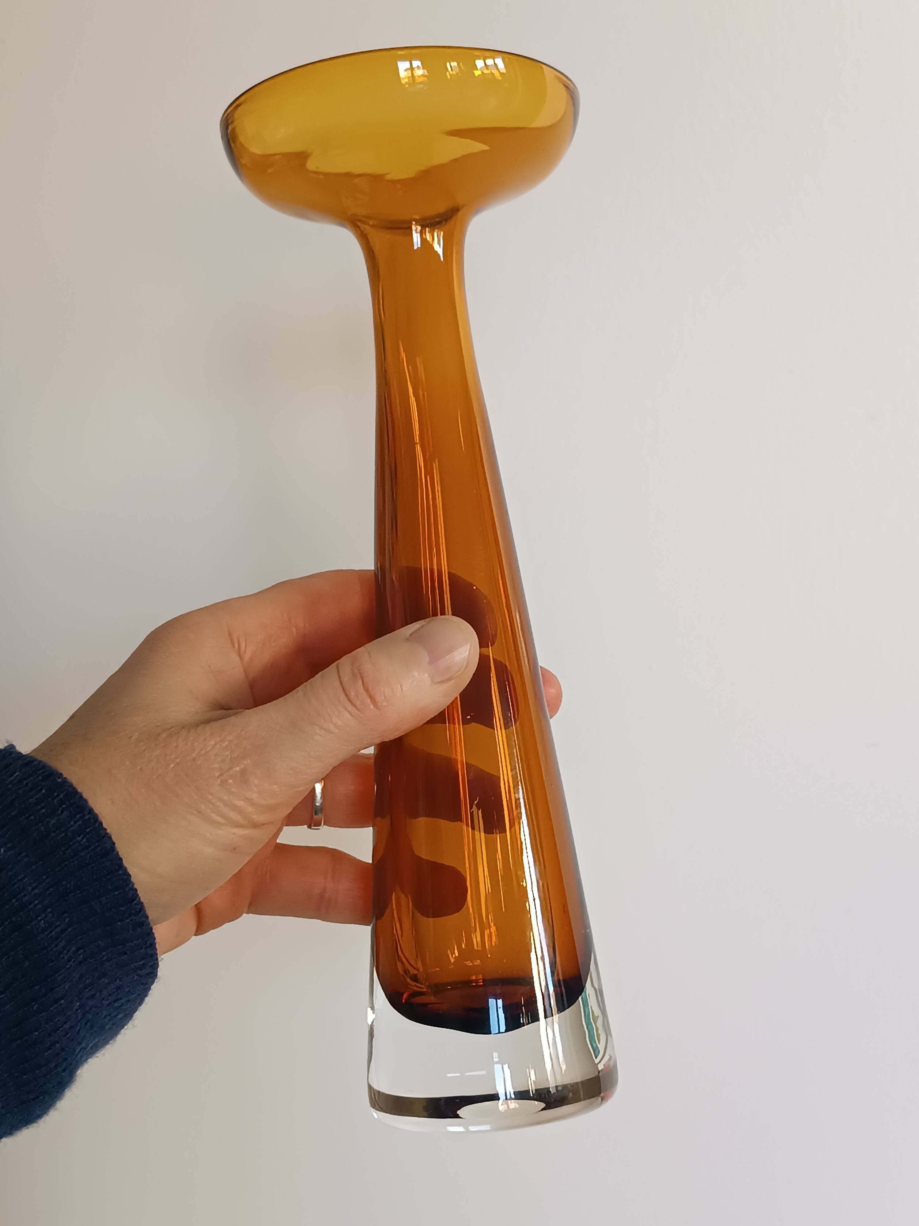 Two vintage Scandinavian double-layered amber blown glass candlesticks