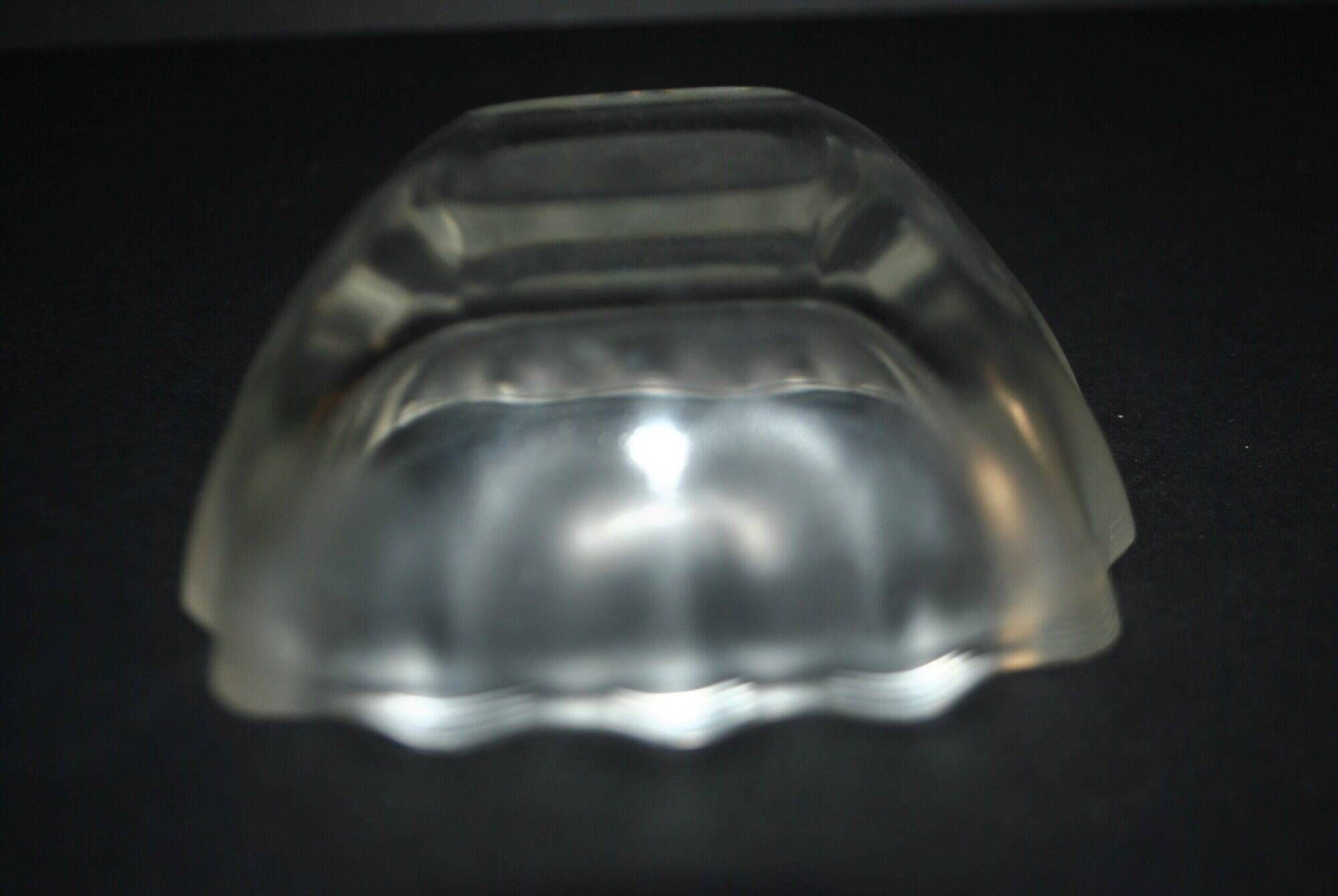 Lalique glass ashtray bowl with frosted finish, engraved with wave design, signed Lalique.