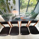 4 Scandinavian chairs in teak and black faux leather.