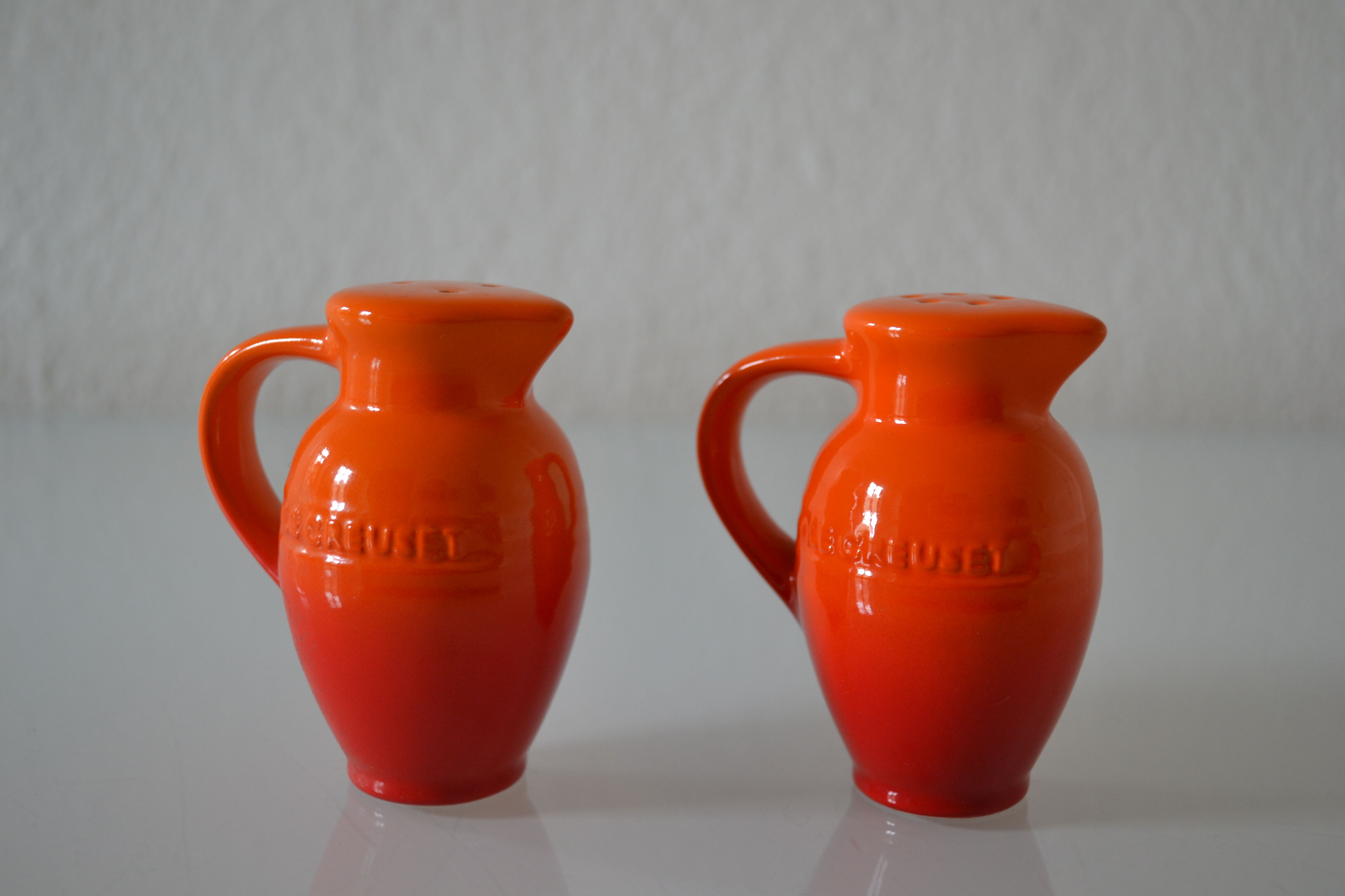 Le Creuset orange advertising salt and pepper
