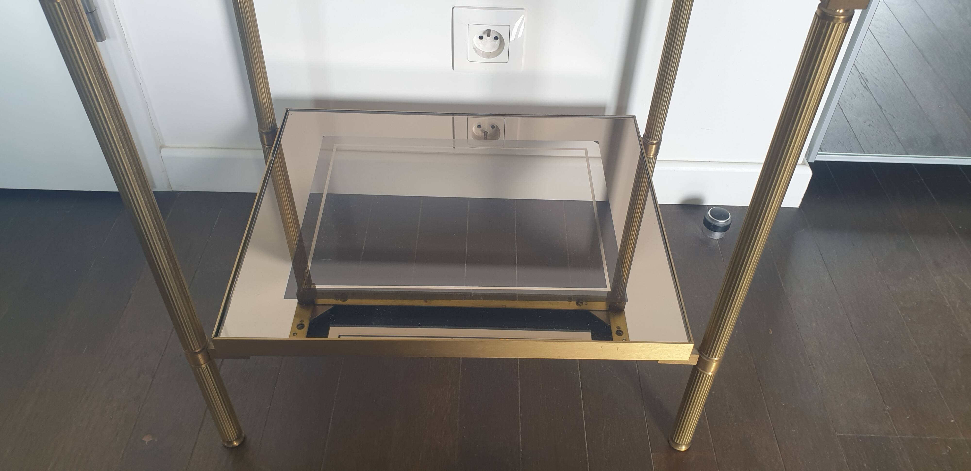 Double tray side table in brass and smoked glass.