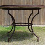 Garden table with wrought iron base
