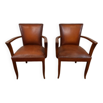 Pair of leatherette bridge armchairs