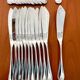 Christofle Marot Berain, 12 fish cutlery sets, shell decor