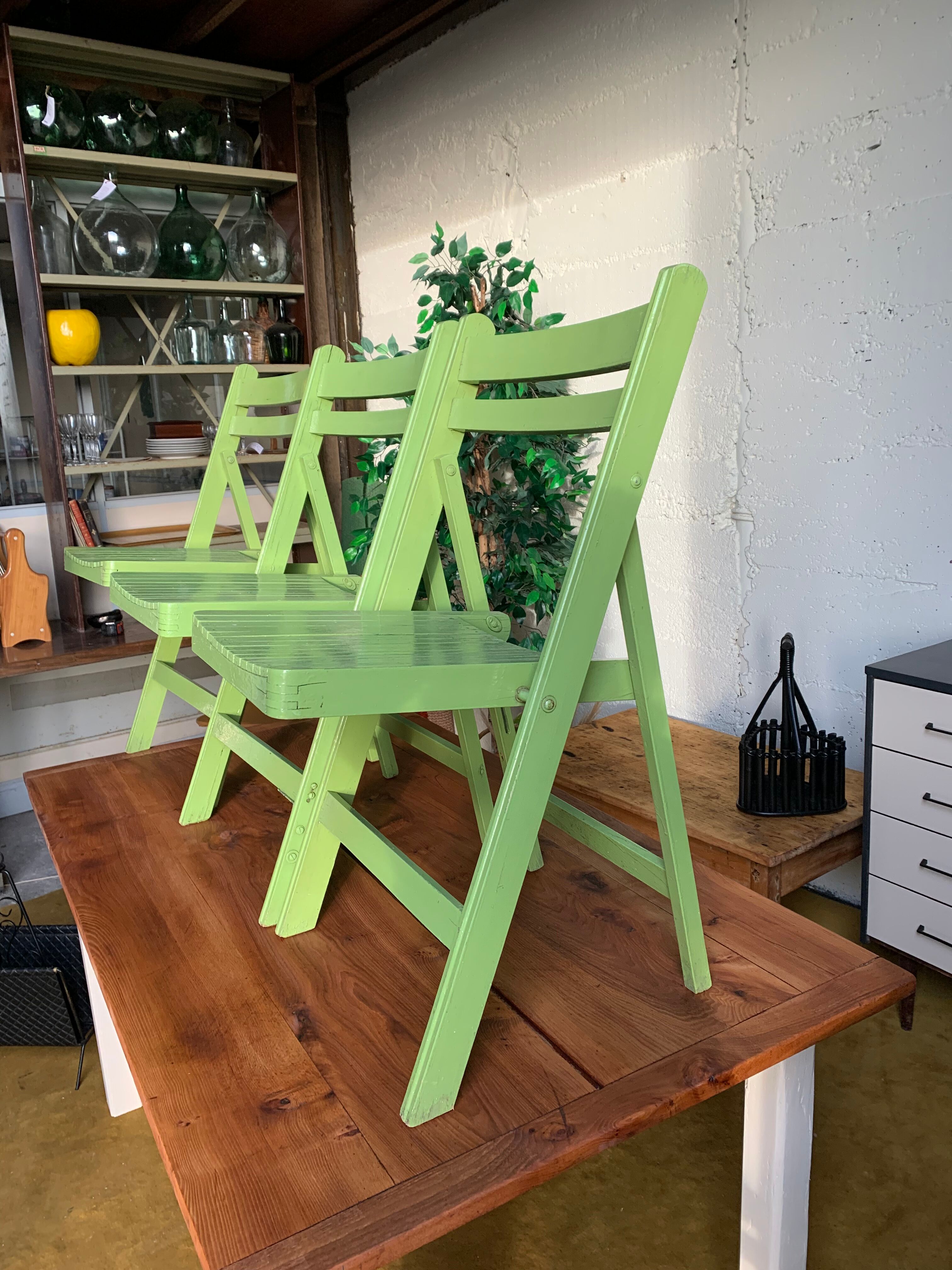 3 wooden folding chairs