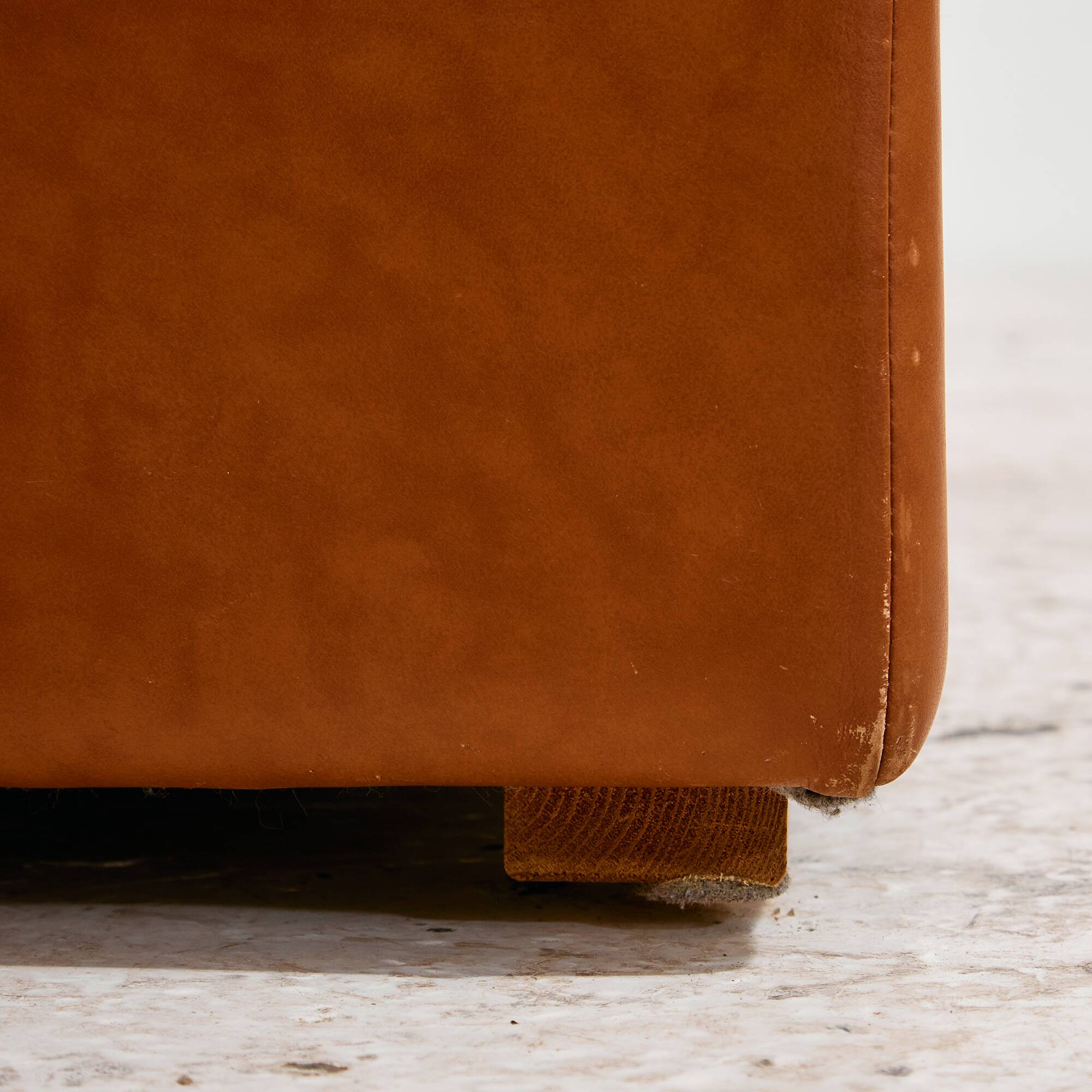 Ottoman with leather upholstery