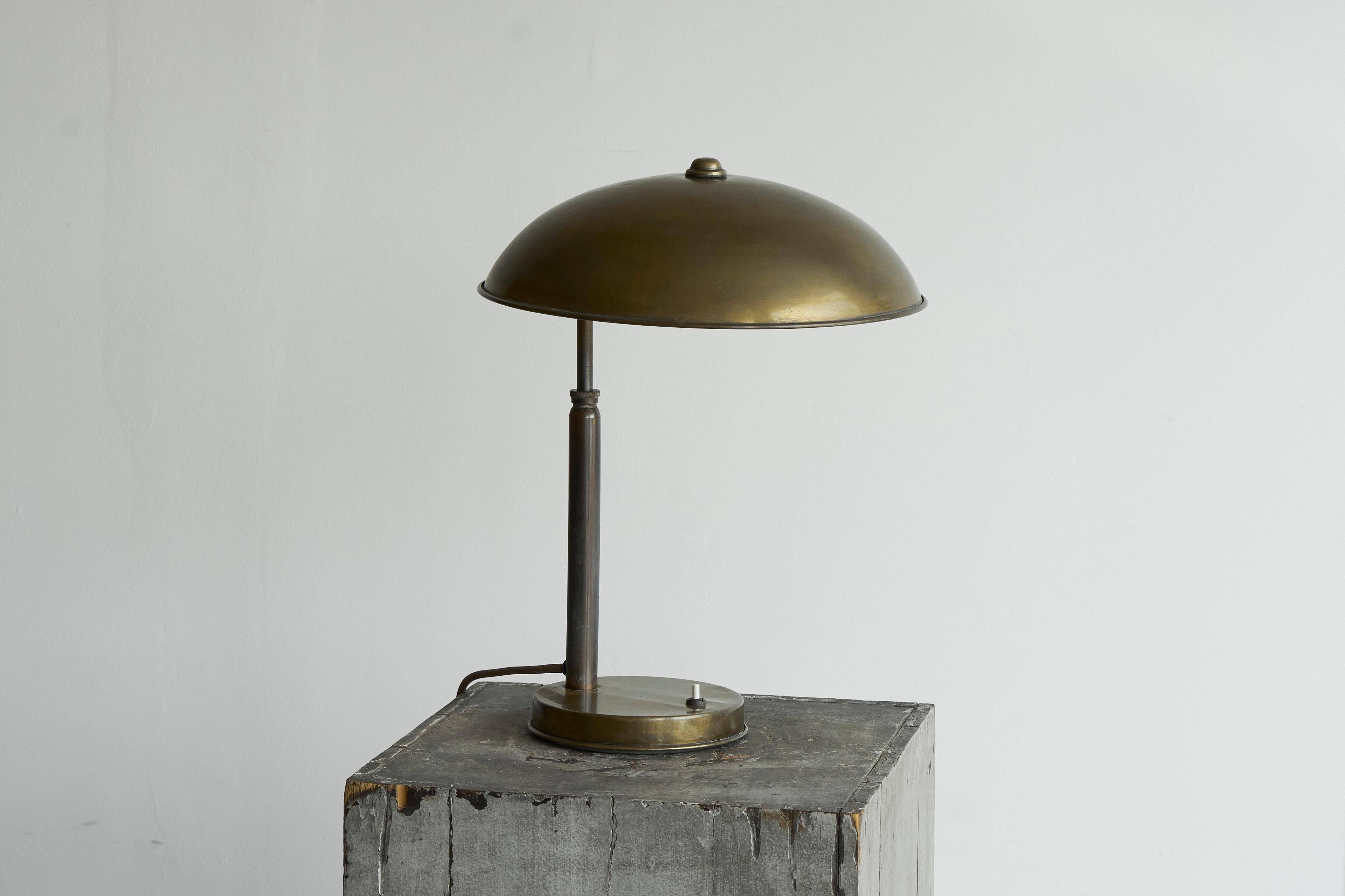 Bauhaus style table lamp in patinated brass from the 1930s.