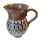 Pitcher with ethnic decorations