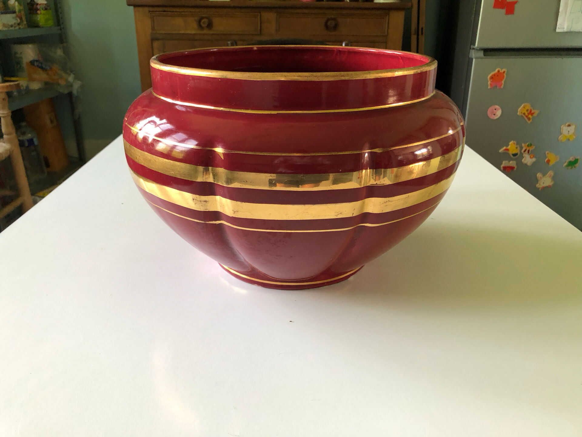 Large burgundy and gold vase