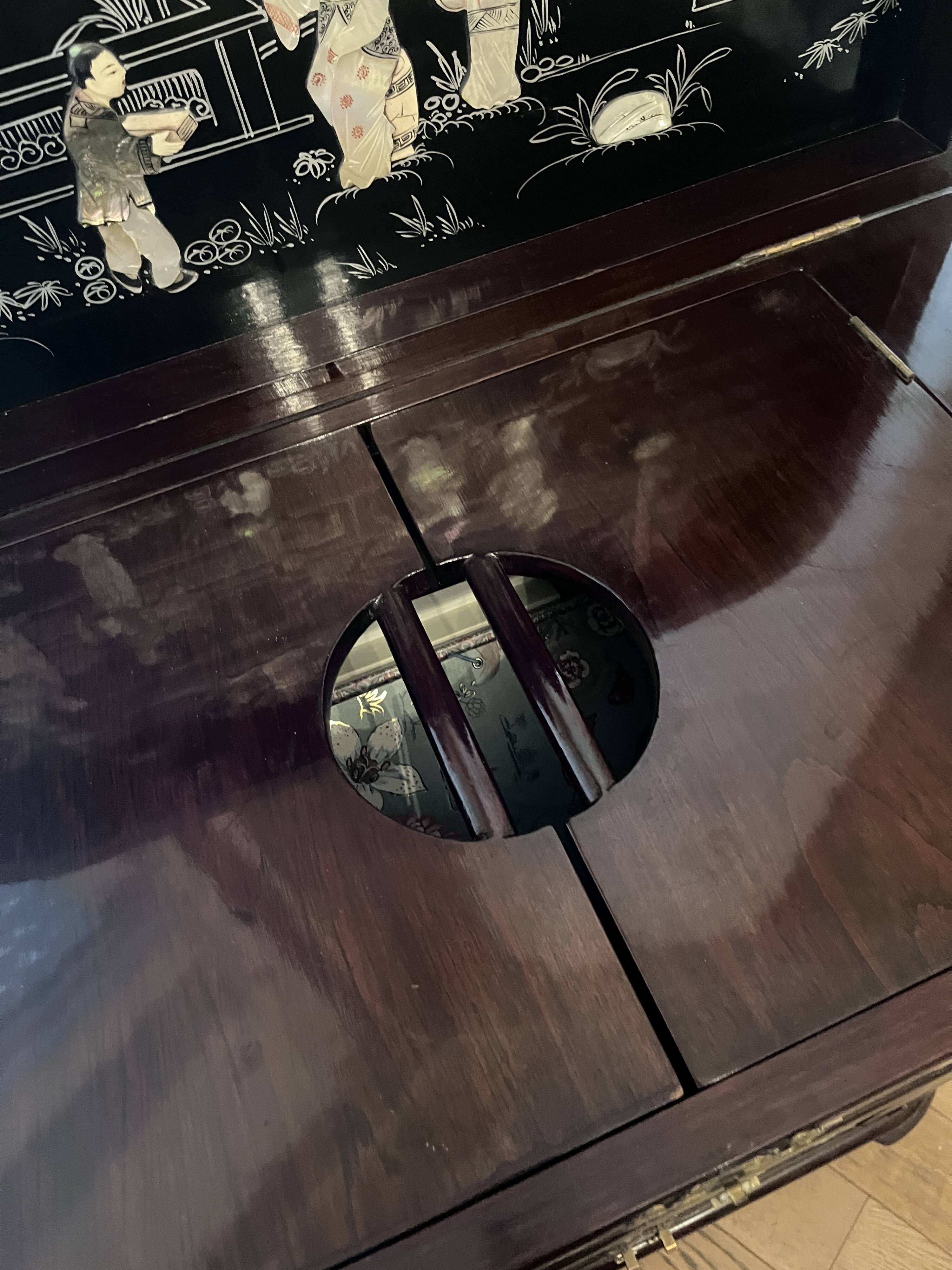 "Chinese black lacquer cabinet, mother-of-pearl inlays, court scenes"