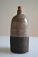 Ceramic bottle vase with a fish signature to be identified.