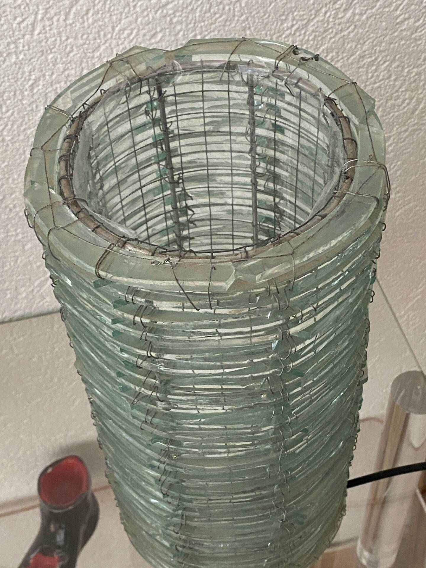 Blue-tinted glass lamp and wire.