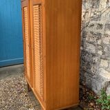 Rattan wardrobe and its compass-legged chest of drawers, 1960