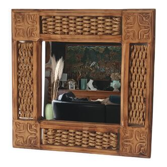 Carved wooden mirror and string