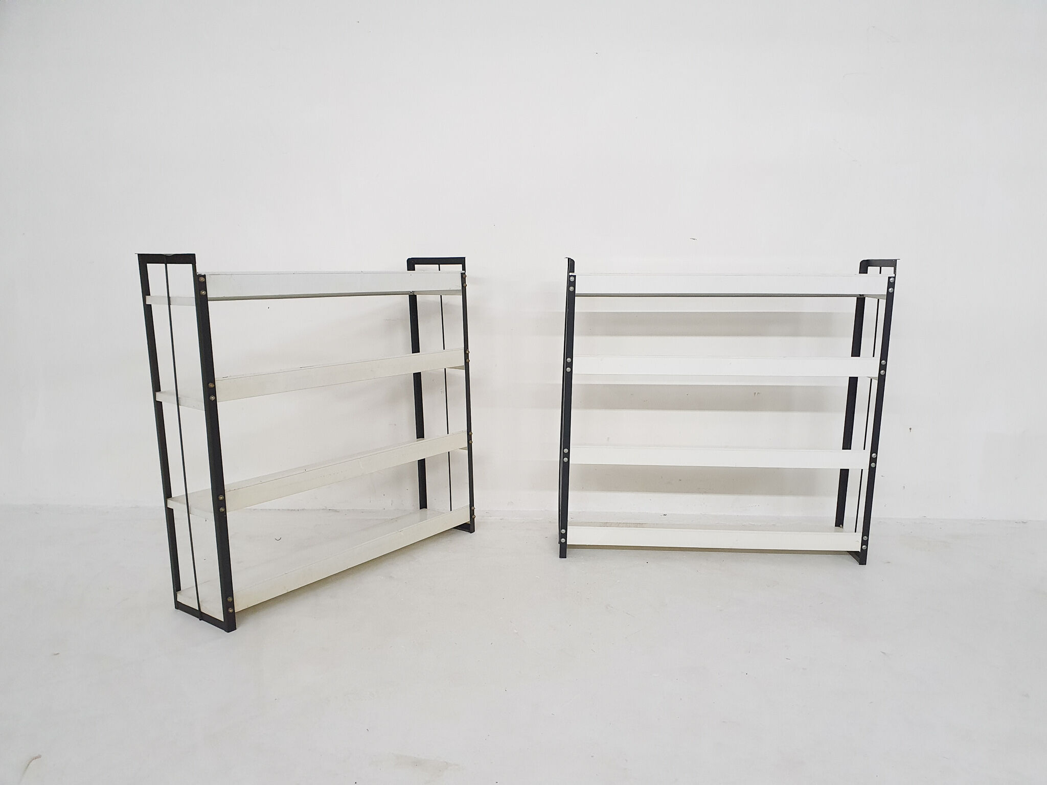 Set of two black and white metal book shelves attrb. to Tomado, Holland, 1950's