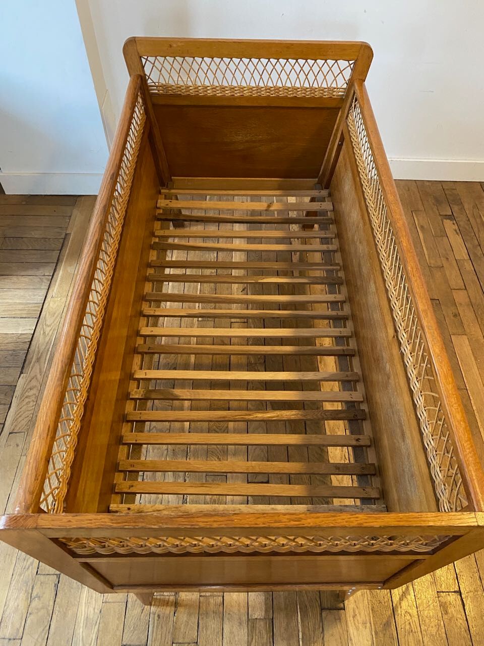 Wooden and wicker baby bed