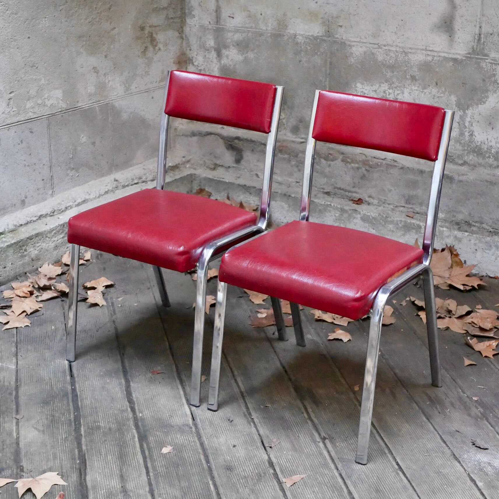 Pair of red leatherette chairs