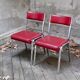 Pair of red leatherette chairs