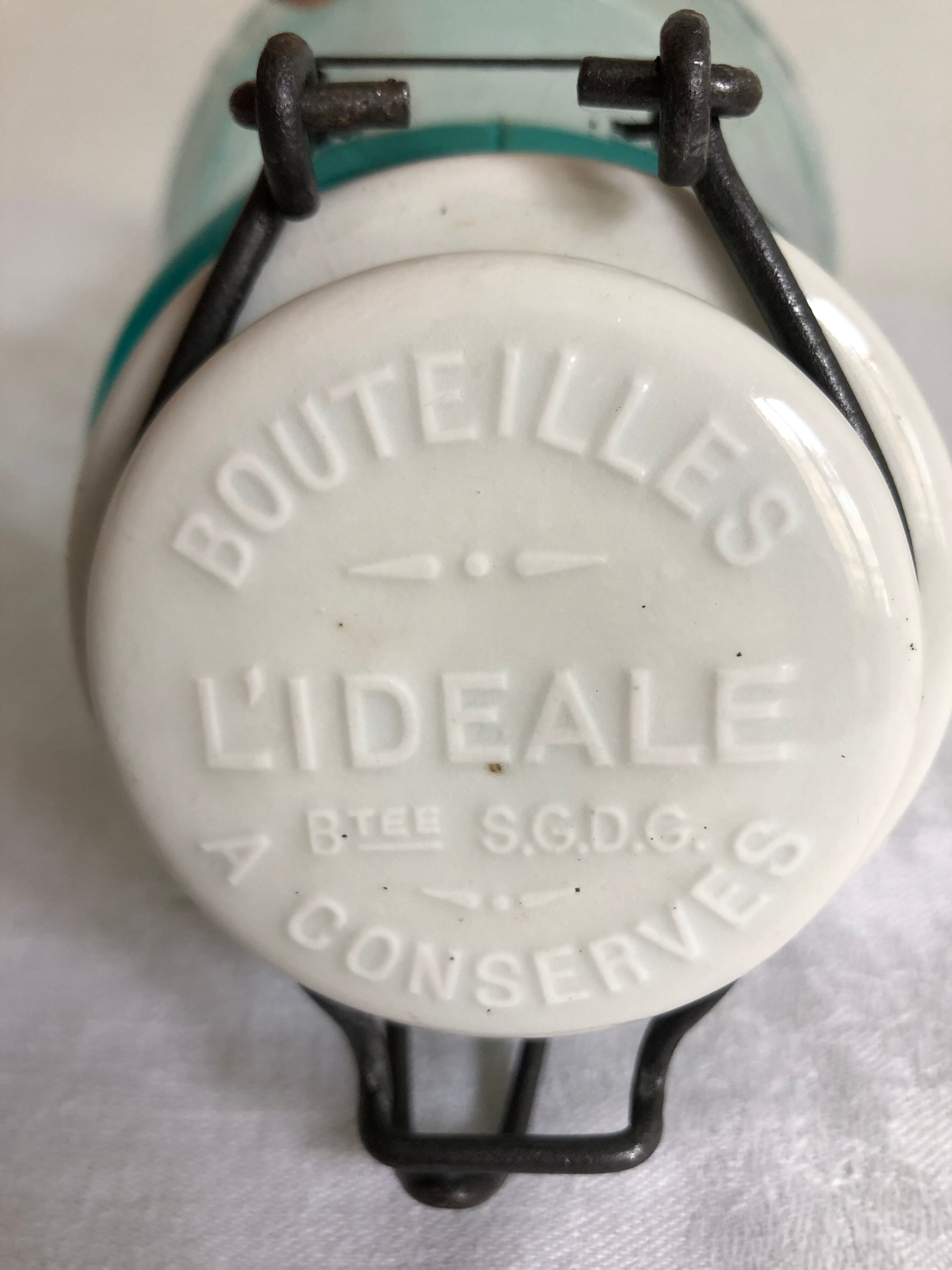 Two bottles with canned goods l'ideale