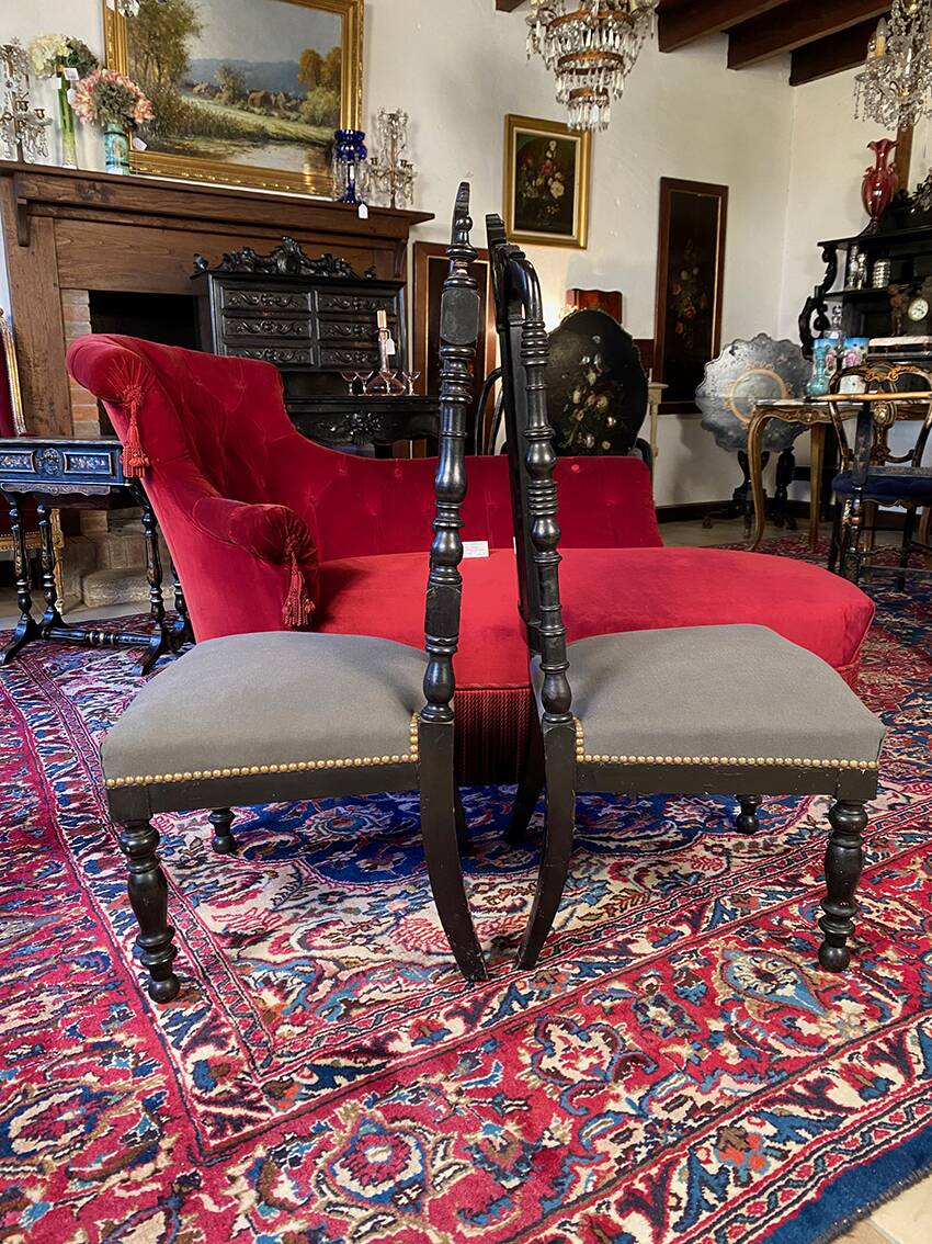 Fake pair of low Napoleon III chairs in blackened wood.