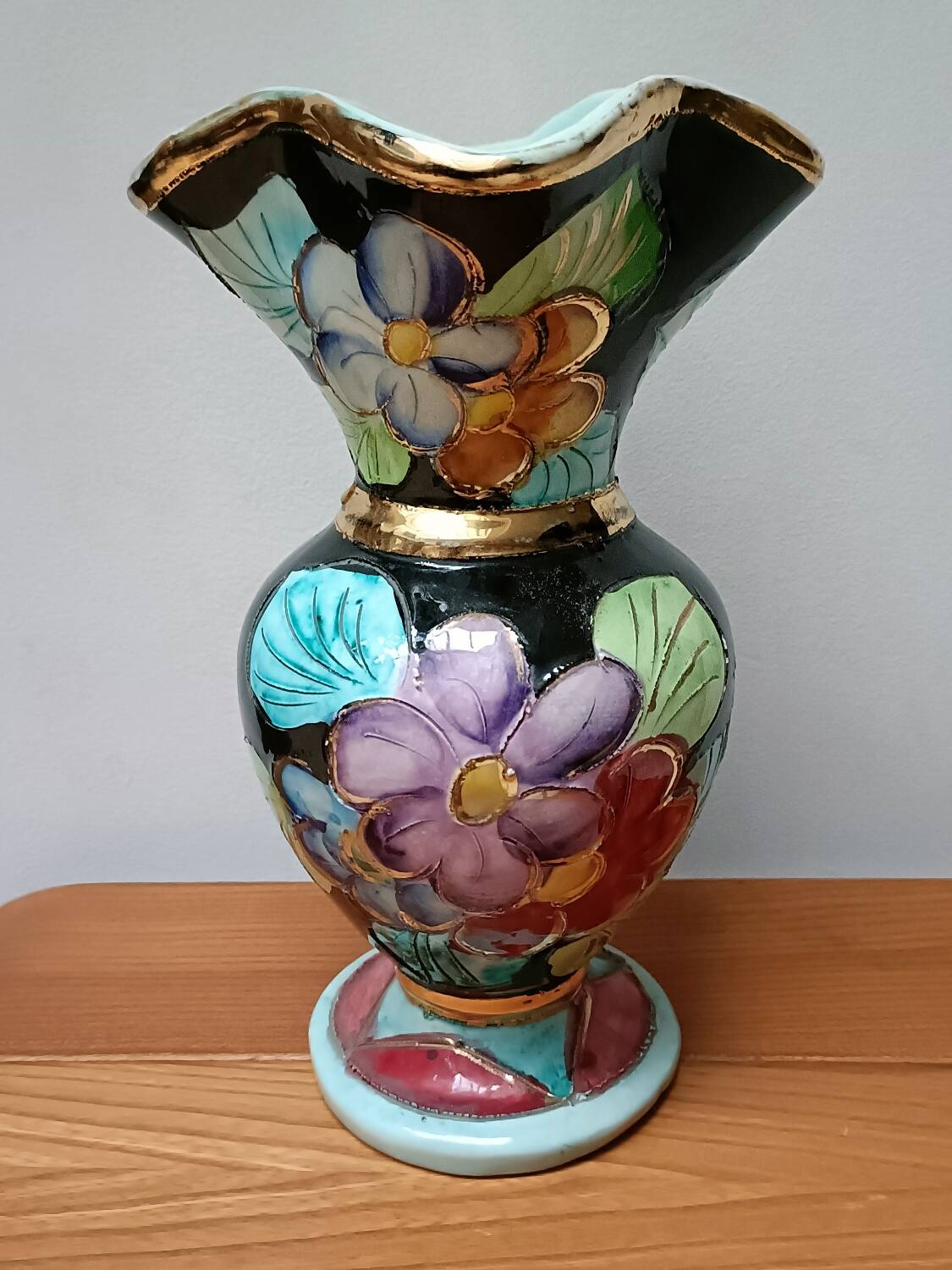 Vallauris vase flowers on black background