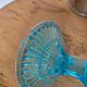 Plate on blue glass pedestal