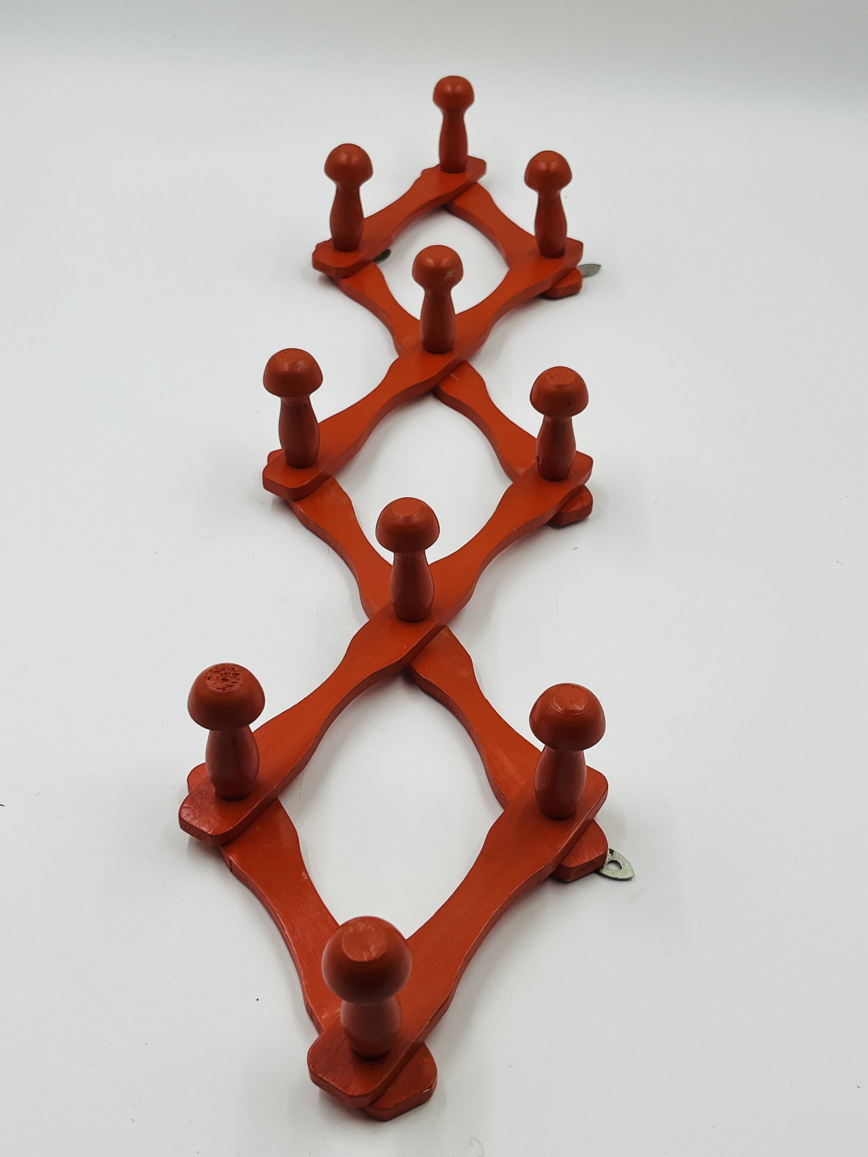 Vintage orange accordion coat rack