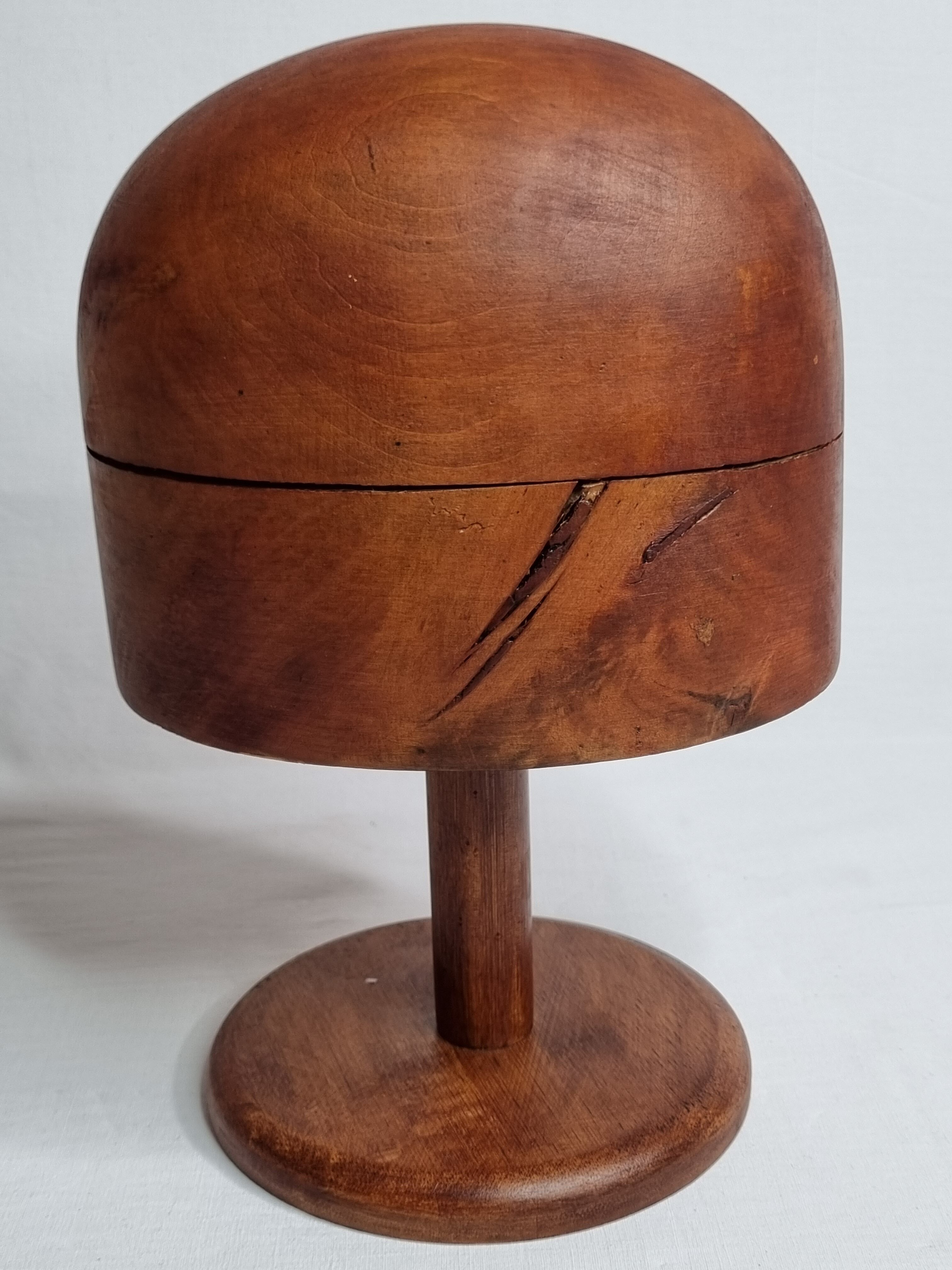 Old wooden hat shape on foot, 1900